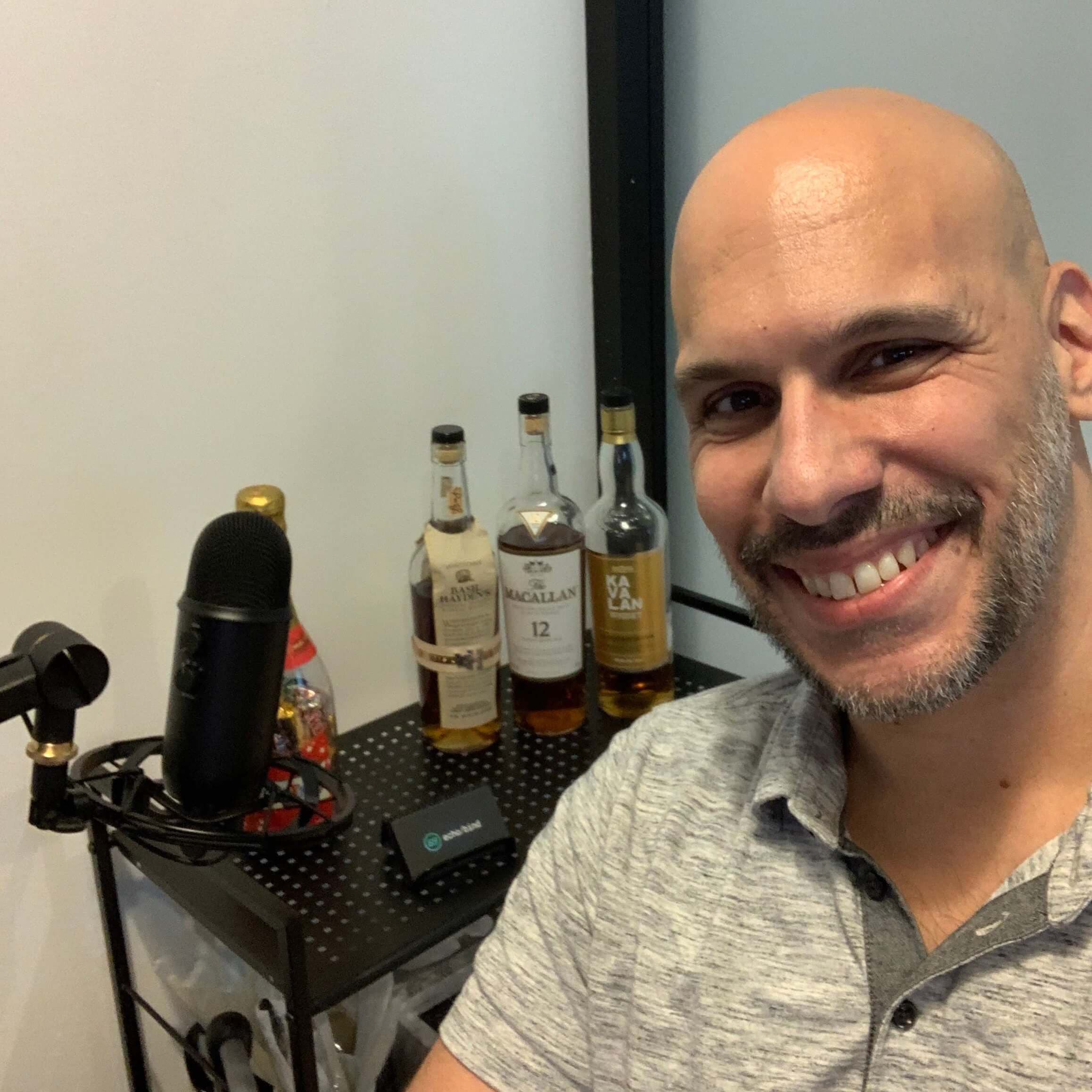 Mike Cavaliere in his office, smiling at the camera.