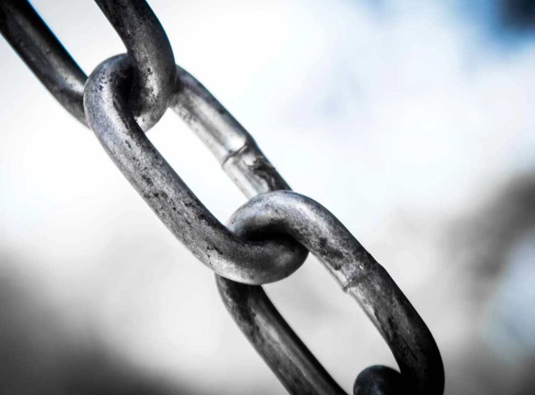 A detailed close-up of a chain link, showcasing its intricate design and texture.